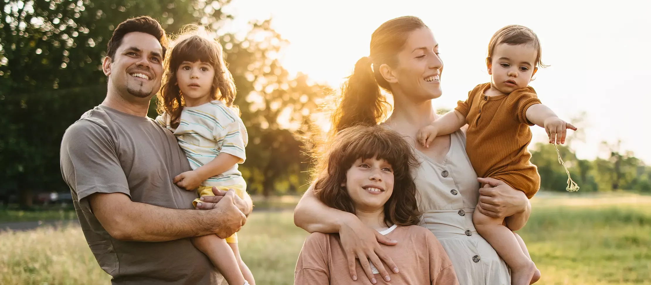 Smiling family outdoors